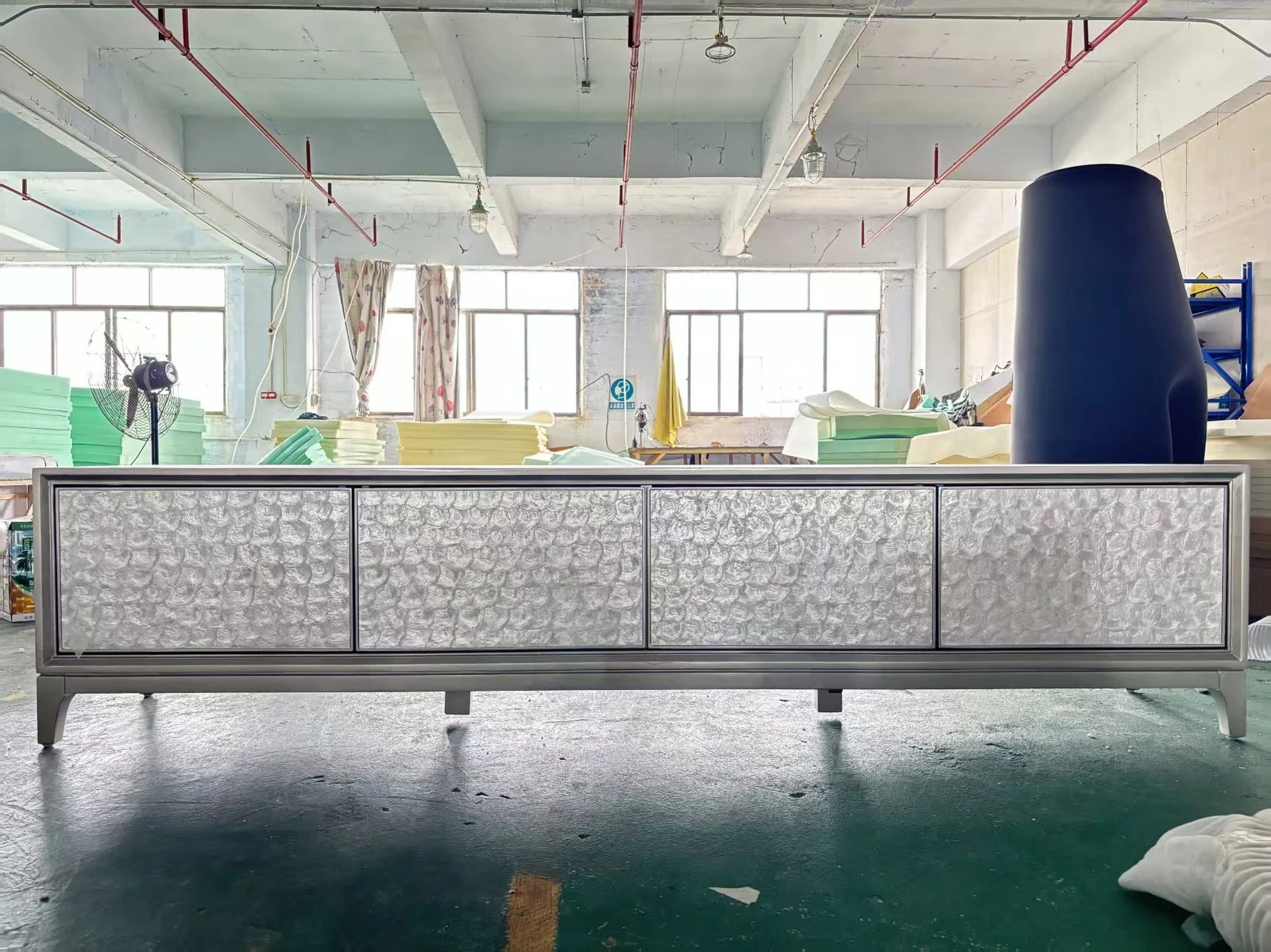 Silver textured wardrobe in a factory setting