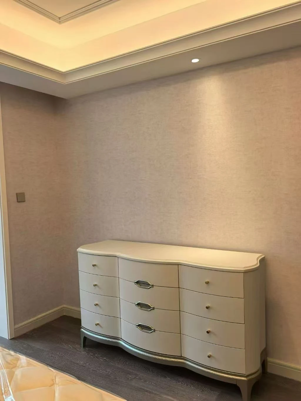 white curved-front chest of drawers